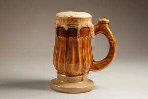 Brown beer stein overflowing with beer and foam photo