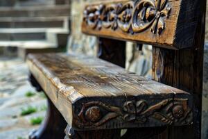 Old ornamented wooden bench standing in front of stone steps photo