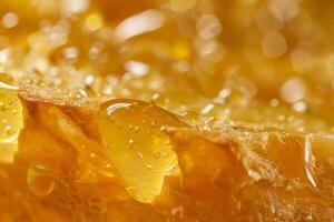 Macro close up of honeycomb dripping with golden nectar photo