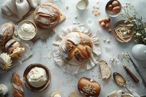 Variety of freshly baked bread loafes with cream cheese spreading on table photo
