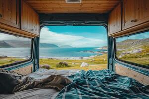 Camper van facing beautiful ocean scenery with open back doors photo