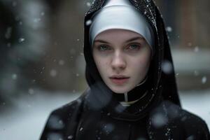 Young nun standing in snowfall with calm expression photo