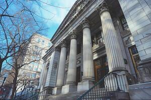 Imposing courthouse building with columns standing tall in winter photo