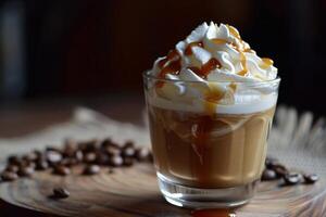 Caramel dripping on delicious whipped coffee with coffee beans scattered around photo
