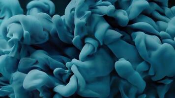 blue ink in water with a black background video