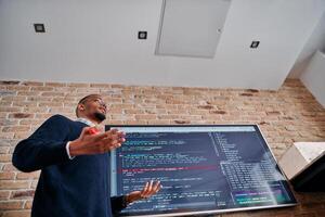 African American businessman delivers a compelling presentation of his business strategy to his colleagues, fostering collaboration and forward thinking photo