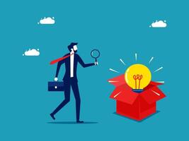 businessman with magnifying glass looking at a box with an idea light bulb vector