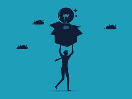 businessman holding up a box with an idea light bulb vector