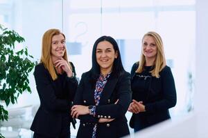 Group of Businesswomen in Modern Office Setting. photo