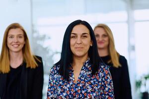 Group of Businesswomen in Modern Office Setting. photo