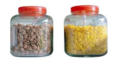 There are 2 dozen glass jars containing cornflakes. photo