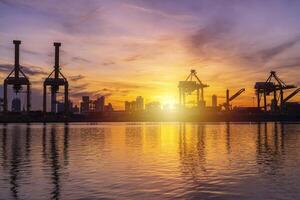 Cargo port that works continuously for loading and unloading goods, water reflection view photo