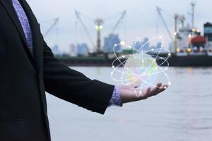 Globe on hand and glow Surrounded by orbits photo