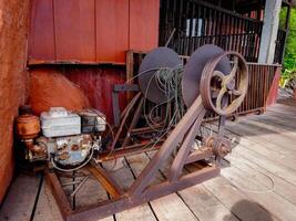 Rusty iron rope used for pulleys pulling very heavy objects or it could be for anchors. photo