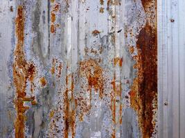 Corroded metal background. The metal walls have rust spots. Rusted metal background with rust marks, rust stains. Rystycorrosion photo