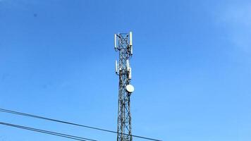 telephone signal catcher tower with a beautiful sky background photo