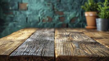 Wooden table in front of brick wall background. photo