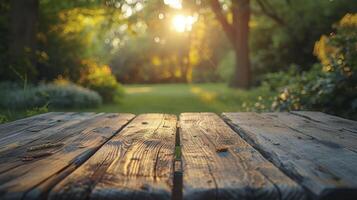 Wooden table in the park at sunset. Nature background. photo