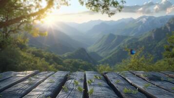 Wooden table in front of a mountain landscape with morning sunlight. photo