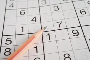 Sudoku puzzle, game to play for keep you brain younger for developing Alzheimer disease in senior patient. photo