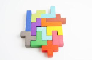 Logical thinking and problem solving problem solution creative business concept, wooden puzzle geometric block shape. photo