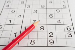 Sudoku puzzle, game to play for keep you brain younger for developing Alzheimer disease in senior patient. photo