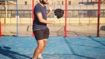 Padel Racket With Man Doing Dribbles On The Glass video