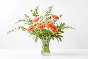Peach Dahlia Bouquet in Glass Vase on White Background photo