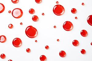 Red liquid drops on white background photo
