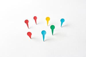 Colorful Paper Pins on White Background photo