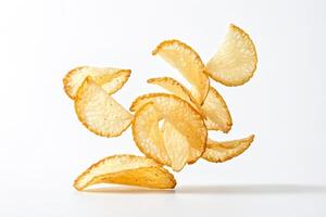 Crispy Cassava Chips Falling on White Background photo