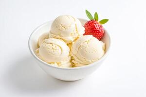 Close-up of Vanilla Ice Cream Scoops in a White Bowl with a Strawberry and Mint photo