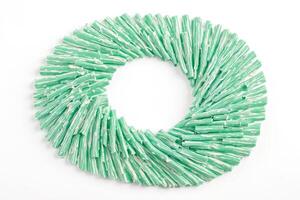Green and white striped sticks arranged in a circle photo