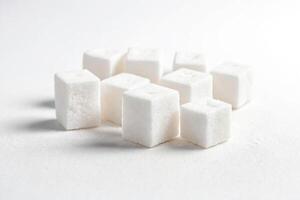 White Sugar Cubes on White Background photo