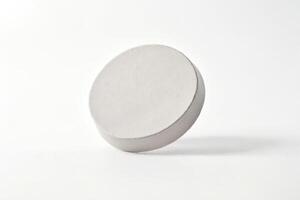 White pill on a white surface photo