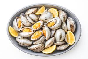 Fresh Clams with Lemon in a Bowl photo