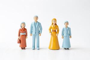 Family of four figurines standing in a row photo