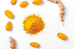 Turmeric Root Powder and Slices on White Background photo