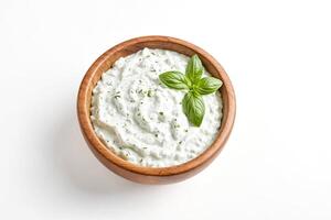 Fresh Herb Yogurt Dip in Wooden Bowl photo