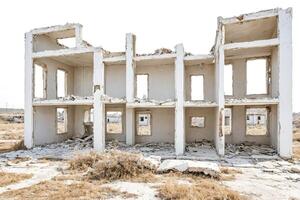 Ruined Building with White Walls and Windows photo
