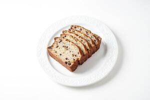 Slices of raisin bread on a white plate photo