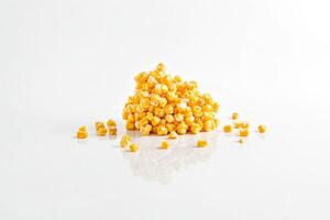 Heap of Corn Kernels on White Background photo
