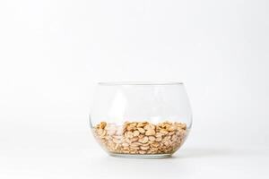 Glass Bowl with Cereal on White Background photo