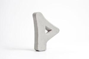 Grey Clay Rune Symbol on White Background photo
