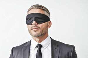 Blindfolded Businessman in Suit photo