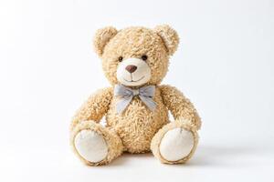 Plush Teddy Bear with Blue Bow Isolated on White Background photo