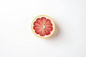 Closeup of a Sliced Grapefruit on a White Background photo