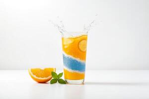Orange Juice with Ice and Lemon Slice in a Glass with Splashing Water photo