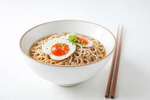 Close Up of a Bowl of Ramen with a Soft Boiled Egg and Chopsticks photo