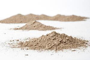 Small Piles of Dirt on White Background photo